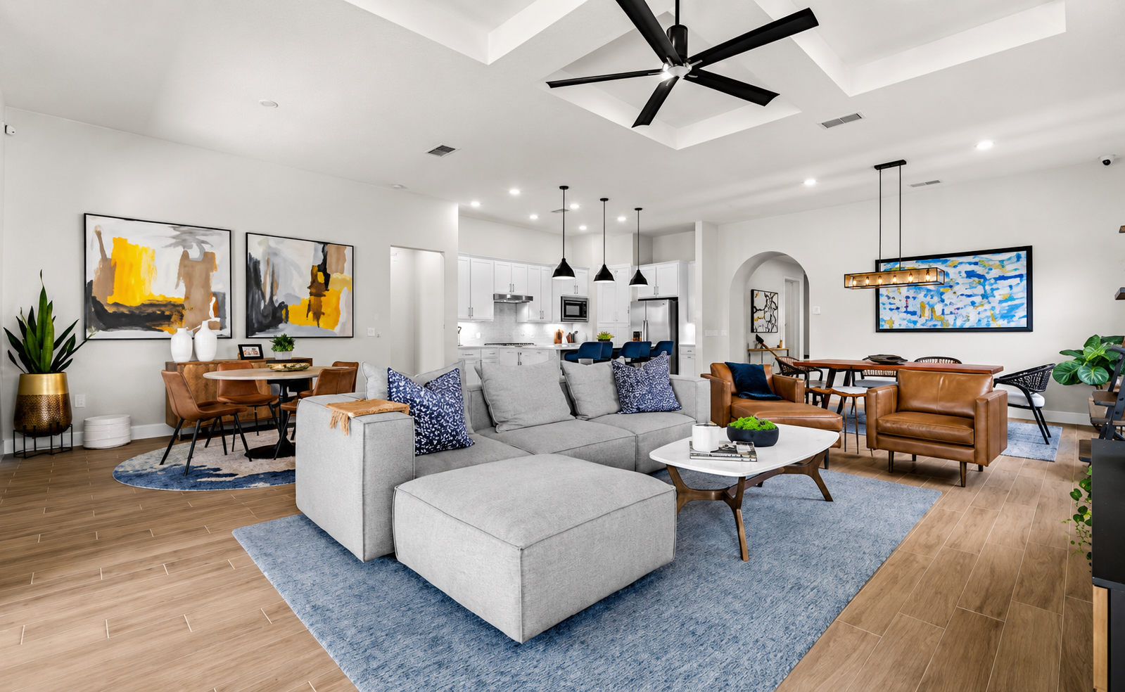 Open-plan new-build living, dining, and kitchen space with warm modern finishes